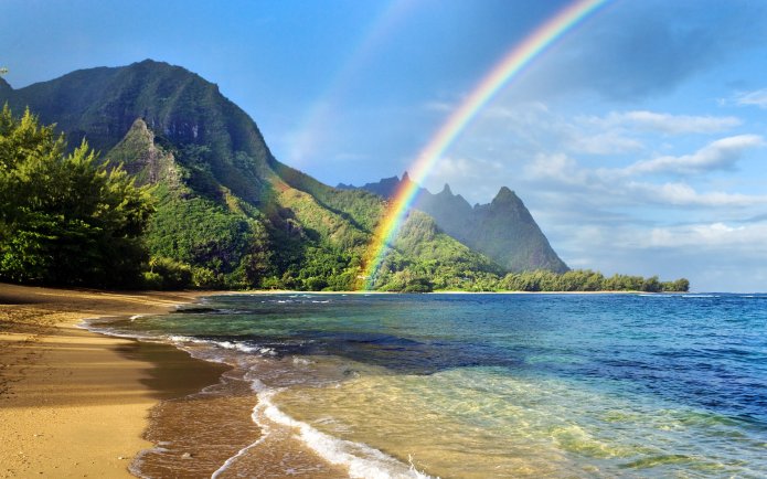 Rainbow over coastline, Haena Beach, Kauai, Hawaii, U.S.
